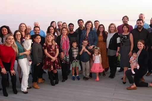 The Reed Lab and collaborators posing outside lab party.